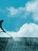 Photo of a Silhouette Power Washing Guy Cleaning Roof Photo of a Silhouette Power Washing Guy Cleaning Roof